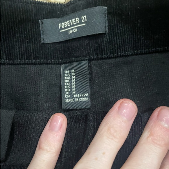 Forever 21 women’s size medium ribbed black mini skirt with button detail - Picture 2 of 3